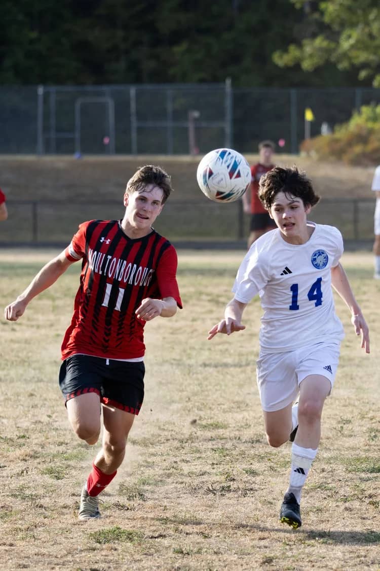 High school soccer players competing for the ball