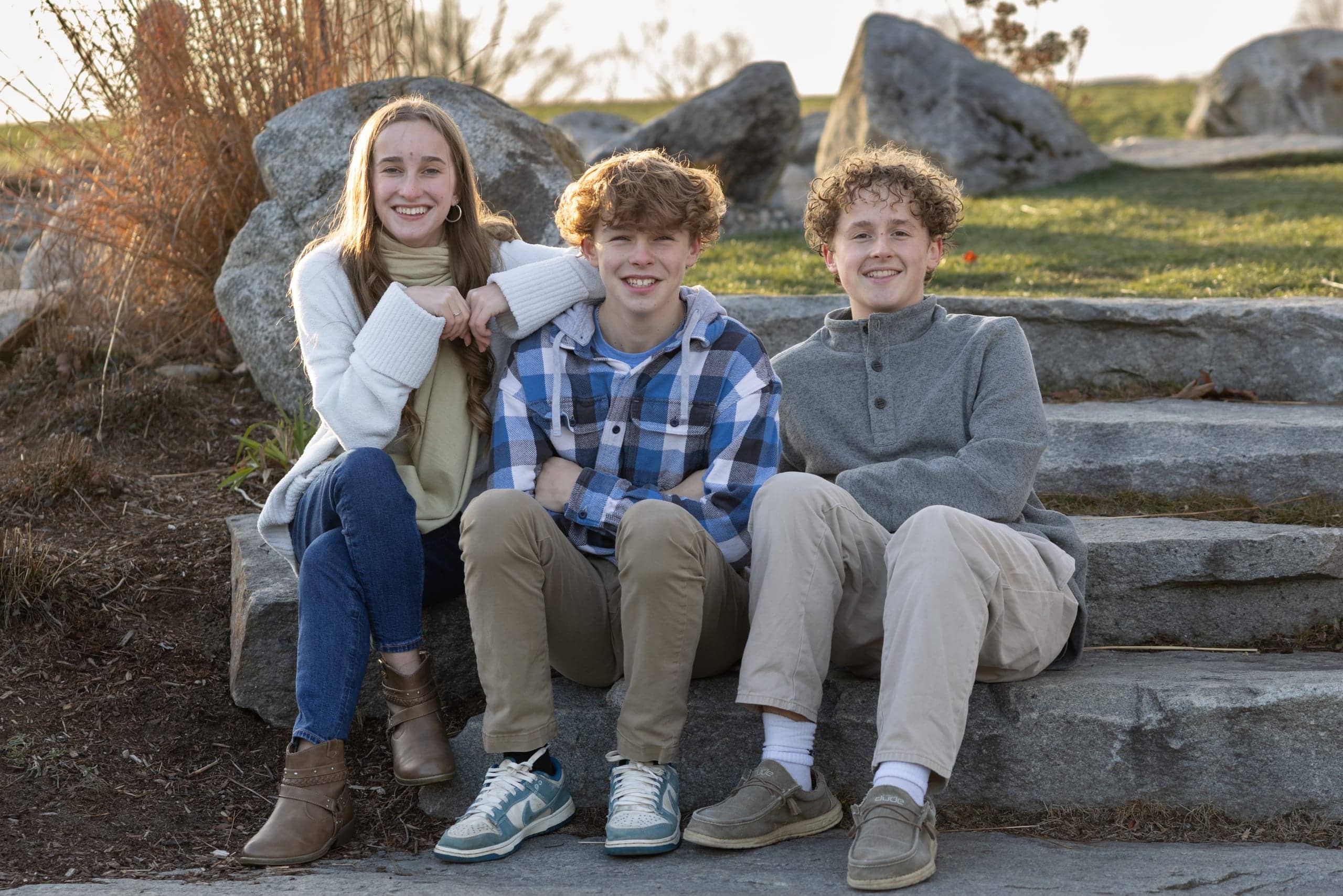 Children together during an outdoor family portrait session