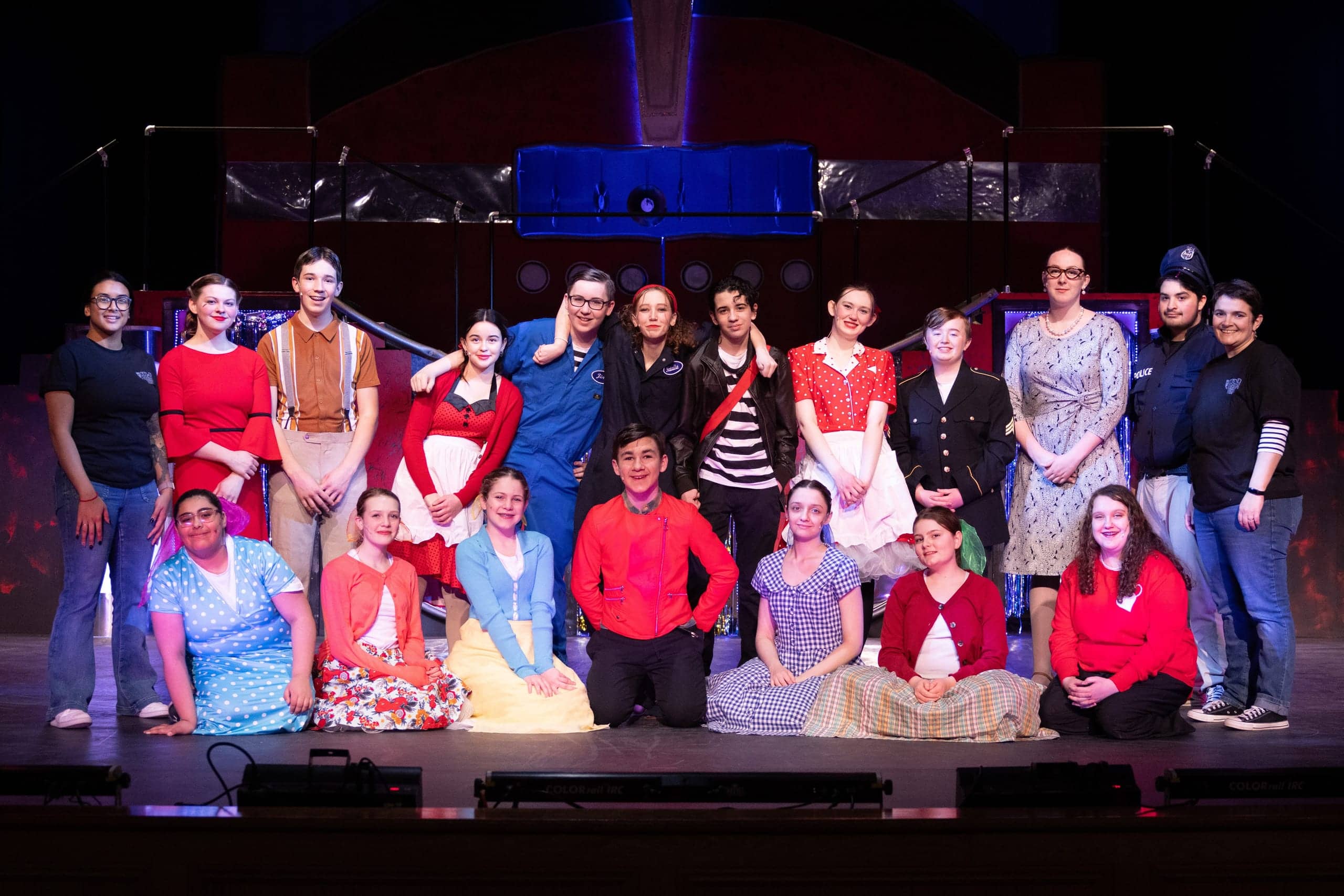 Cast of All Shook Up posed together onstage in spring 2024
